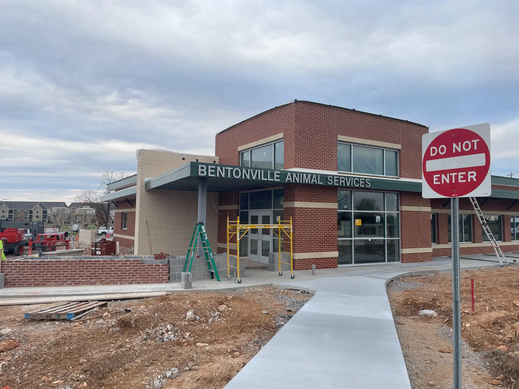 Commercial storefront doors, windows, and exterior building signage installed for Bentonville Animal Services.